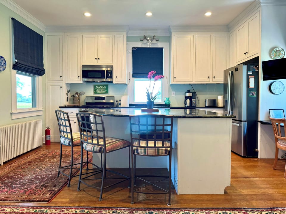 Kitchen - to the left is the screened porch/outdoor dining area.