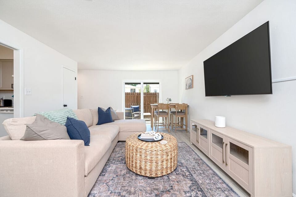 Cozy living room with a 55-inch TV, perfect for enjoying time with friends and family.