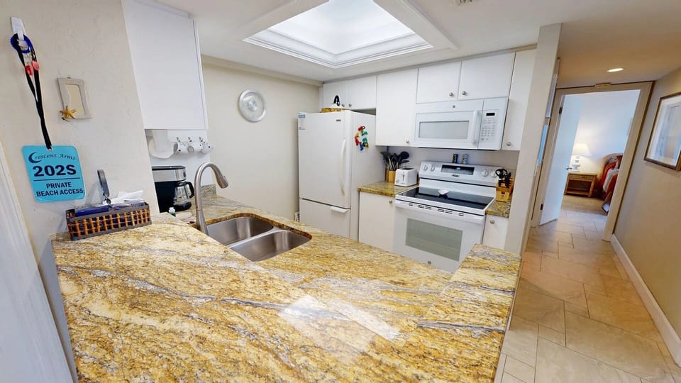 Open concept kitchen allows ocean views while preparing meals.