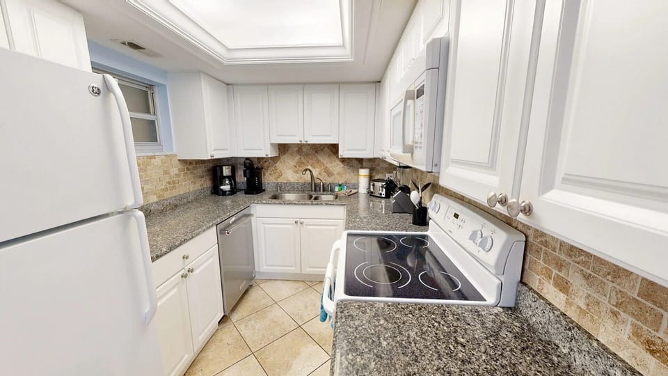Kitchen is fully stocked for all your cooking needs.