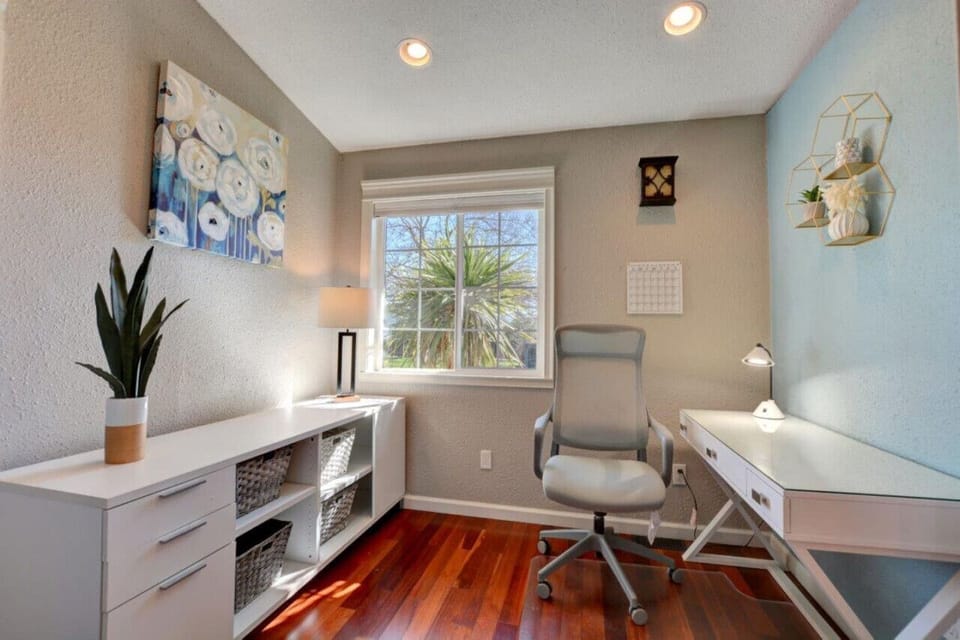 Workspace with desk, chair, storage.