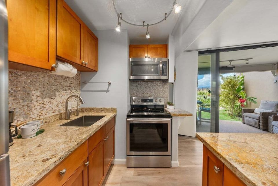 Cook with ease in a stylish kitchen featuring stainless steel appliances and granite countertops