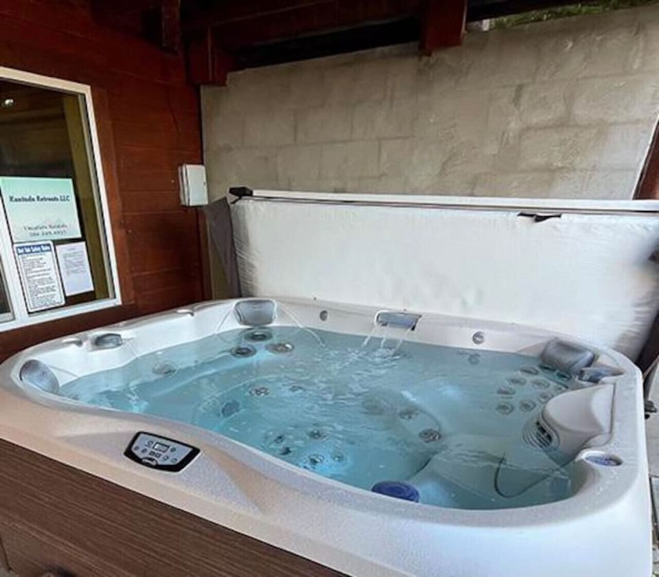 Jacuzzi hot tub under front porch
