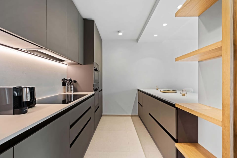 Experience culinary elegance with state-of-the-art appliances and a stylish finish.