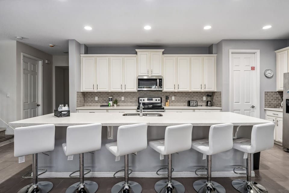 Another angle of the bright kitchen highlighting ample counter space.