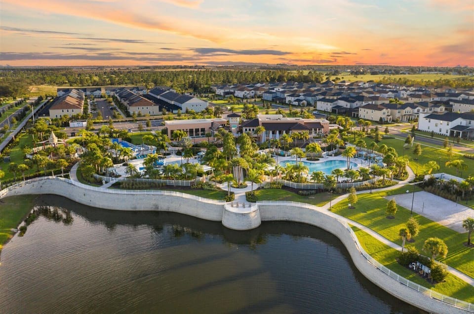 Aerial view showing the surrounding neighborhood and scenic waterways.