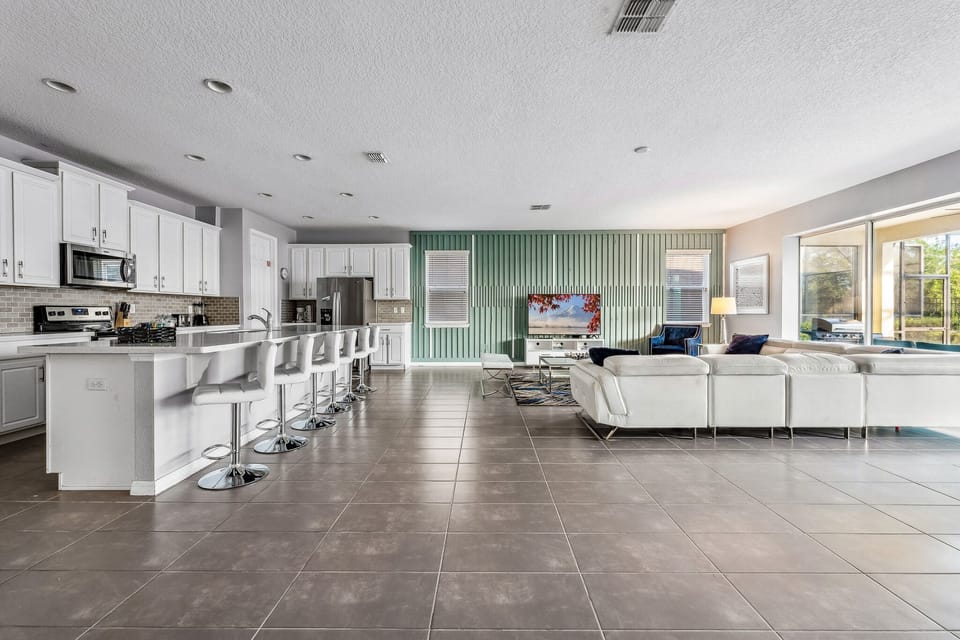 Open-concept kitchen and dining area designed for cooking and gathering.