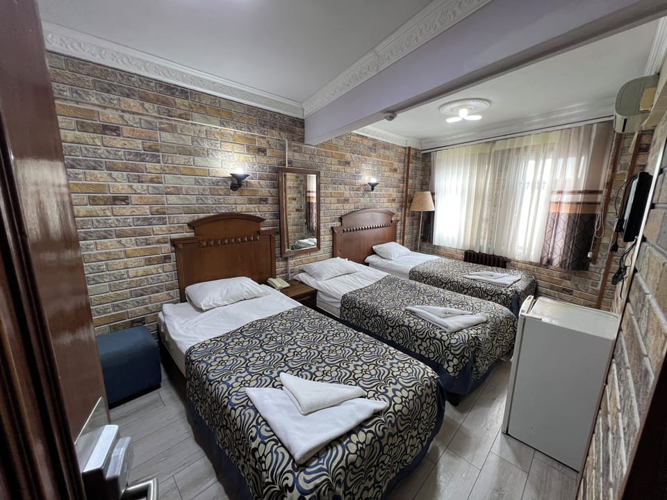 Standard Triple Room, Sea View | Desk, laptop workspace, soundproofing, free WiFi