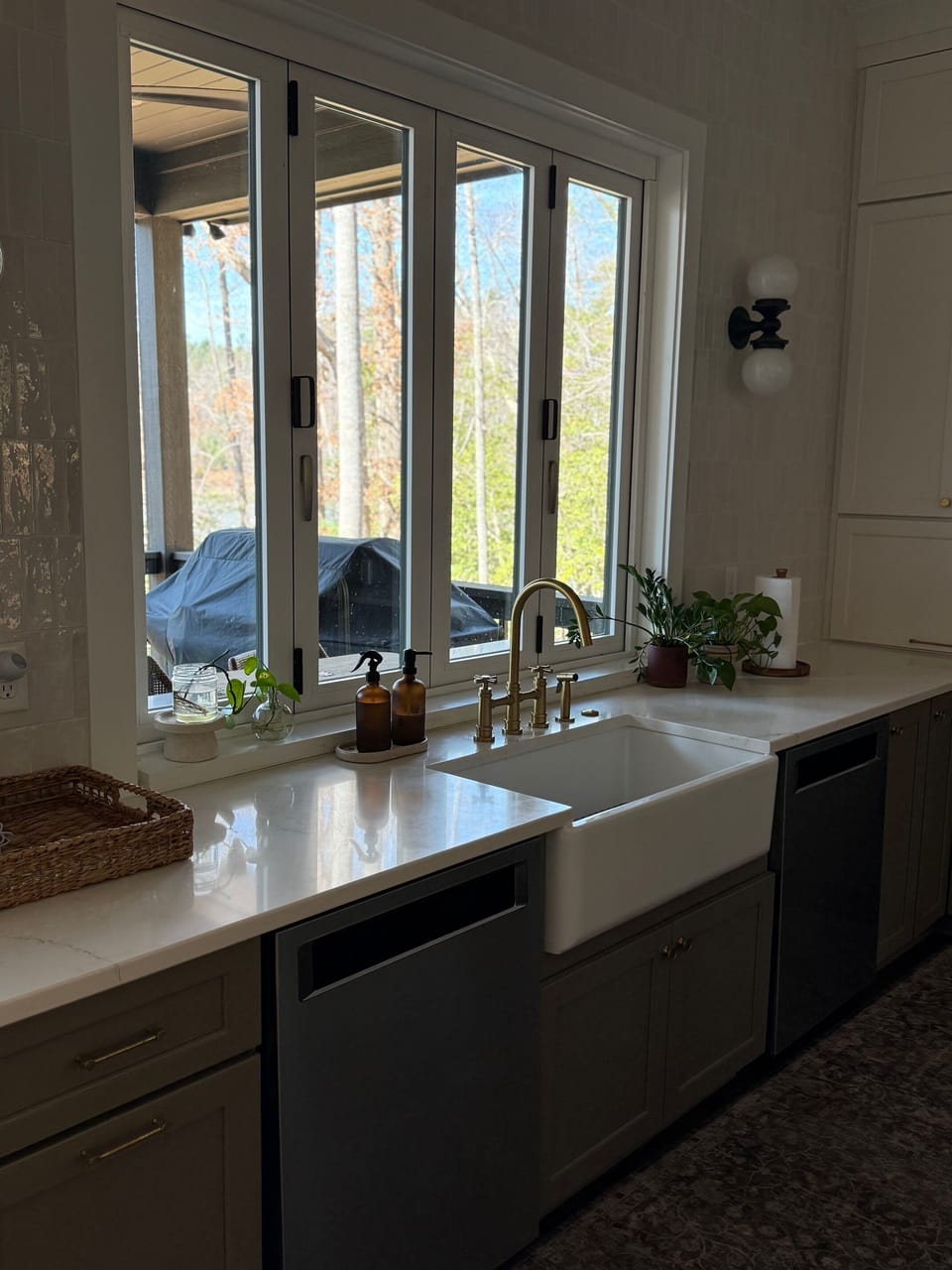 Kitchen sink with accordion window