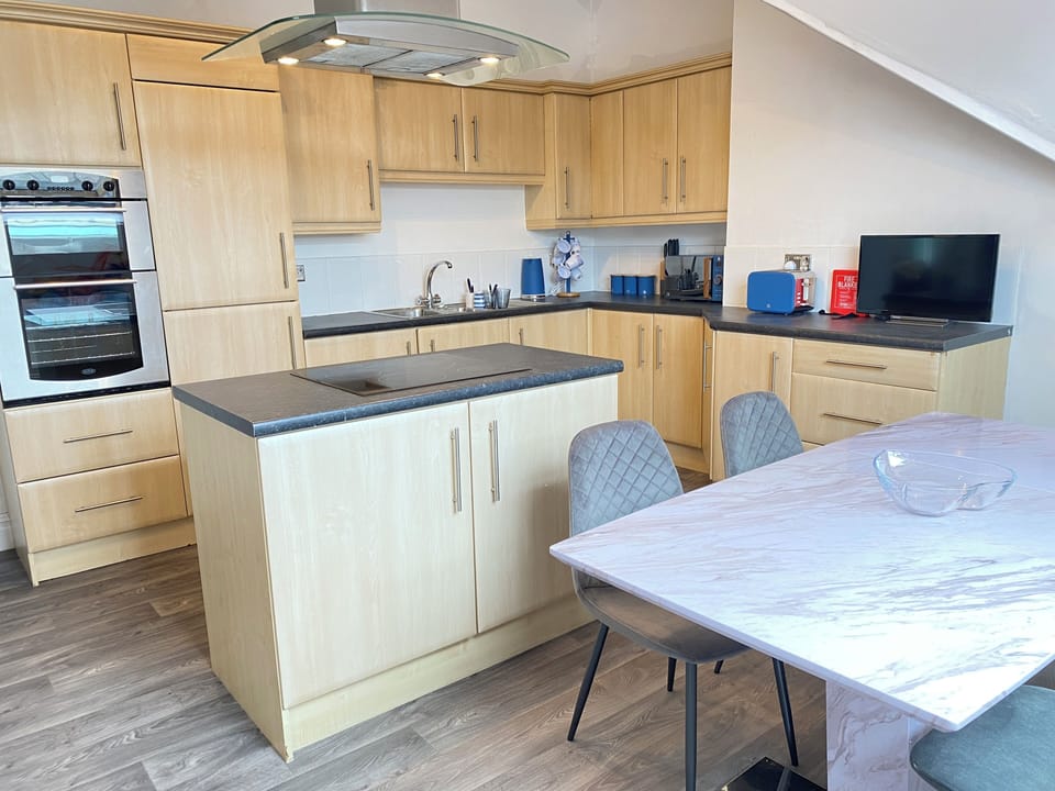 Spacious kitchen with washing machine and dishwasher