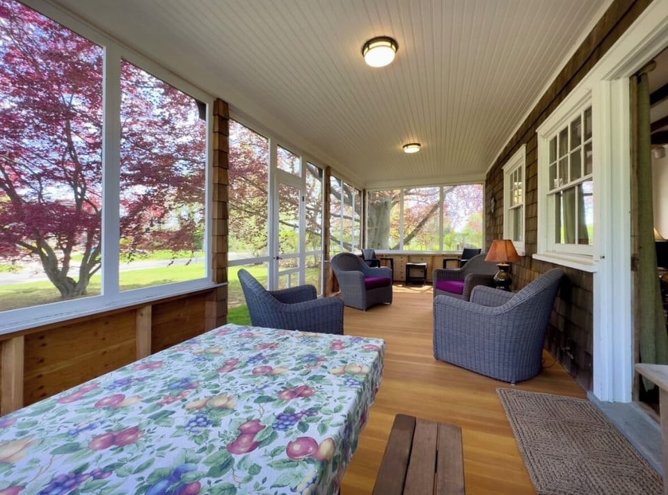 Picnic table with bench seats. Out of the weather and any bugs. 