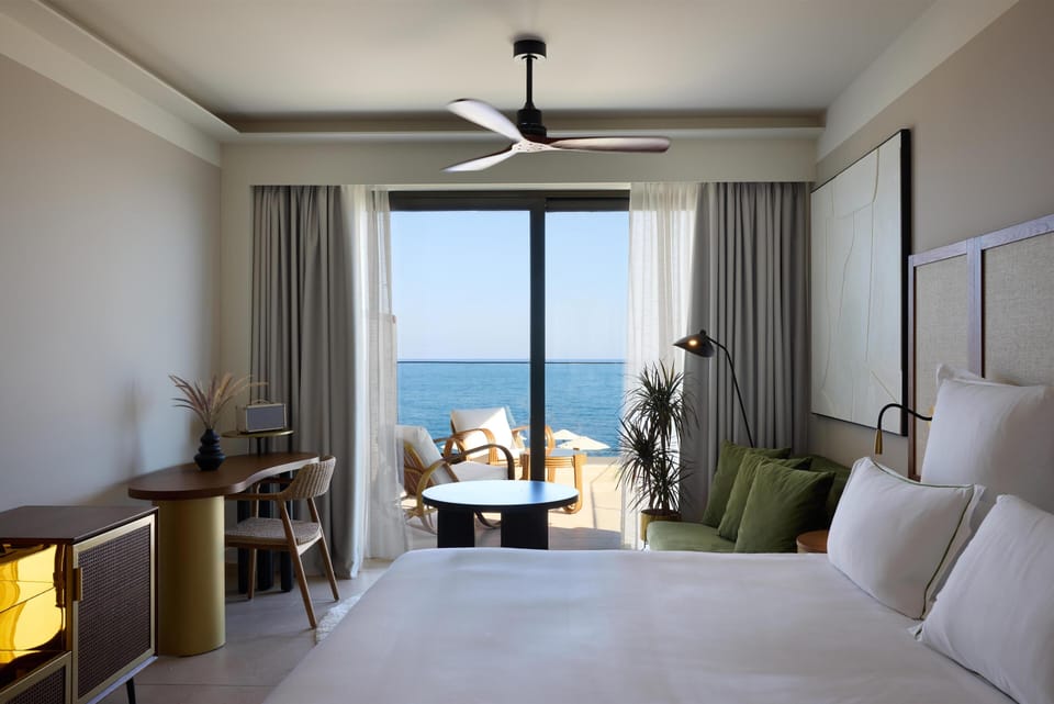 Suite, 1 King Bed, Sea View (Infinite Sea View Escape) | Living area | 50-inch Smart TV with satellite channels, TV
