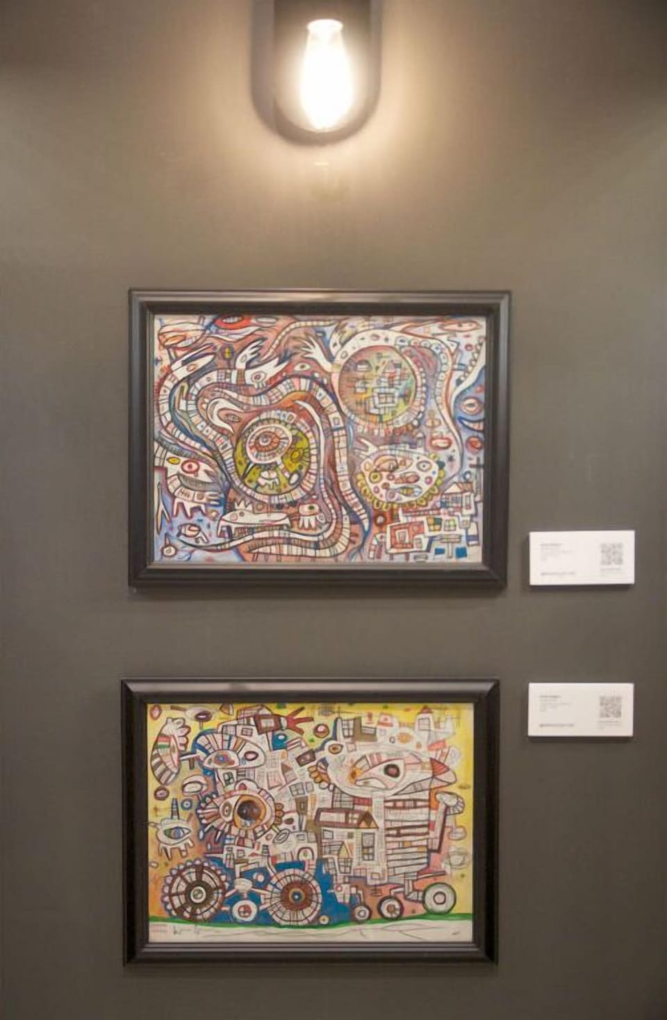 Curated wall of eclectic art pieces as part of the "Southern Abstraction" series.