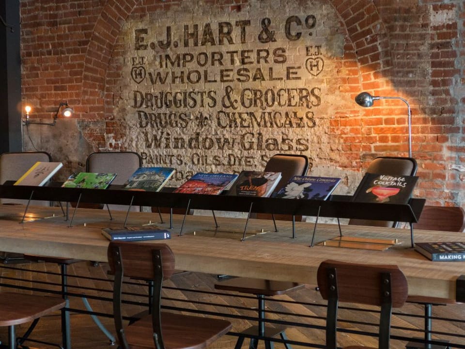 Historic character shines through in the hotel's lobby with brick walls and antique decor