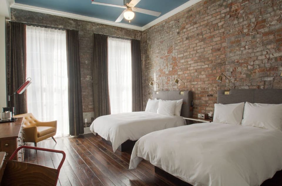 Spacious bedroom blending natural textures with a contemporary edge