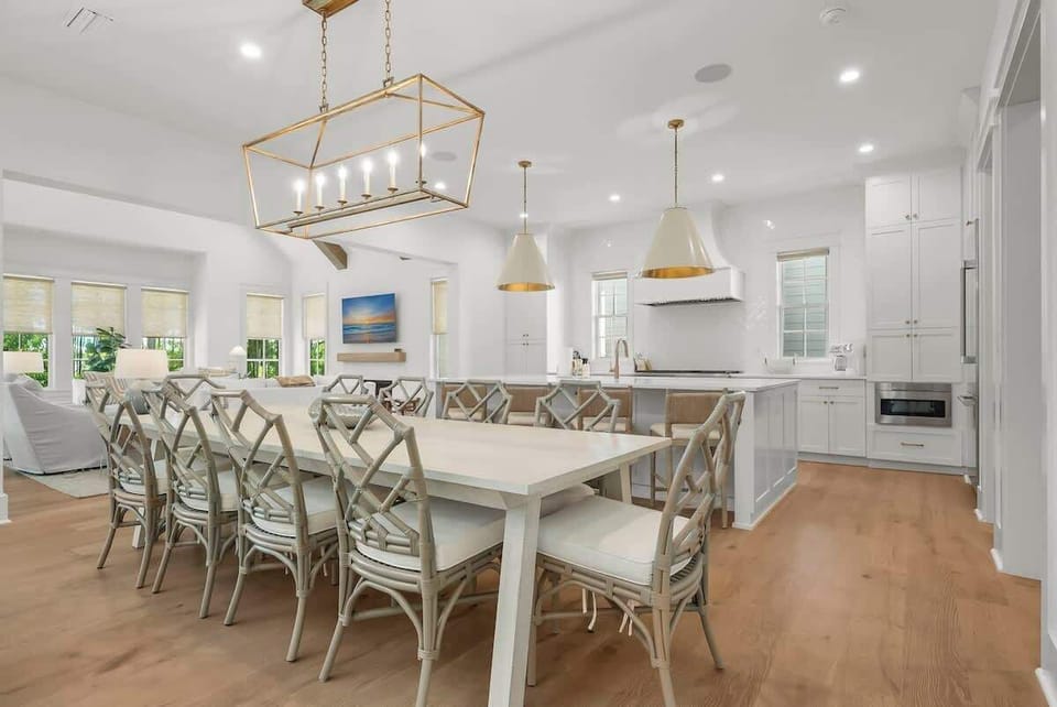Dining room table features seating for 10. Kitchen island includes seating for an additional 4.