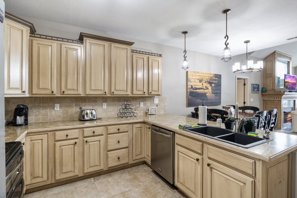 Beautifully designed kitchen with abundant cabinetry and a spacious layout perfect for preparing and enjoying meals together.