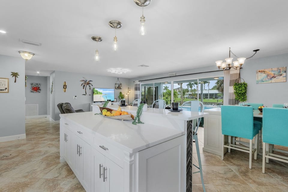 Kitchen island. open floorplan with view to living room and lanai.