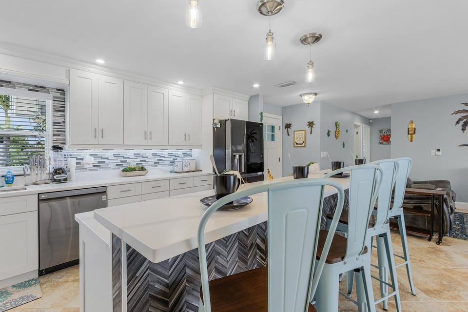 walk through kitchen with a large island. perfect for breakfasts and coffee in the morning.
