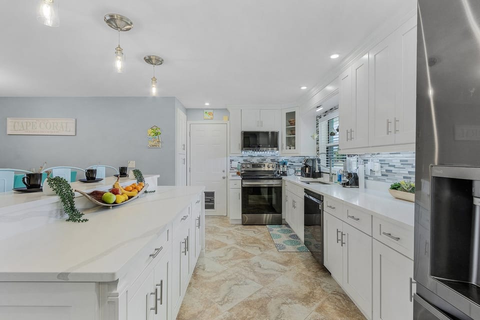 walk through kitchen fully stocked. toaster and keurig coffee maker