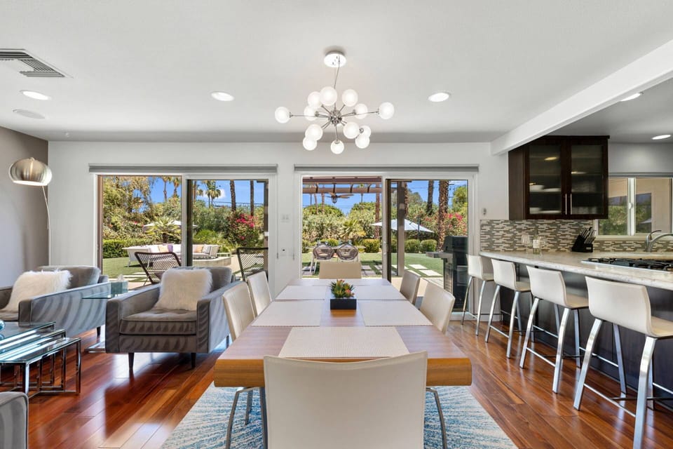 Well-lit Dining Room with Views of the Back Yard