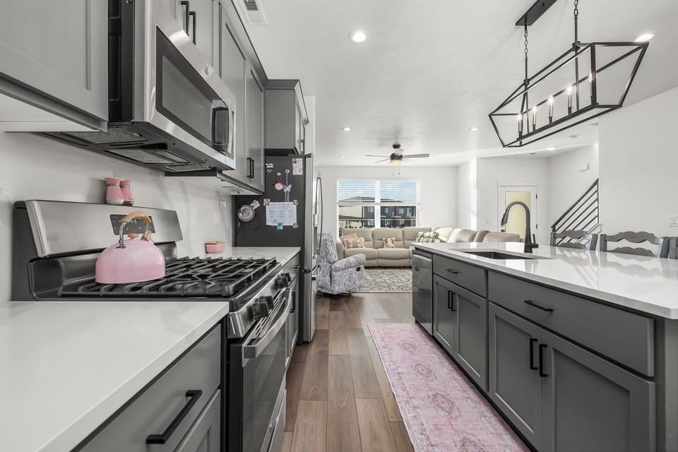 Fully stocked kitchen w/gas stove, fridge, microwave, dishwasher,walk-in pantry