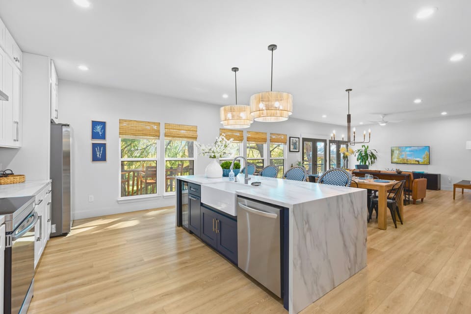 Cook and gather with ease in the fully equipped kitchen, featuring a spacious island that’s perfect for meal prep, casual dining, or enjoying a glass of wine while chatting with friends and family.