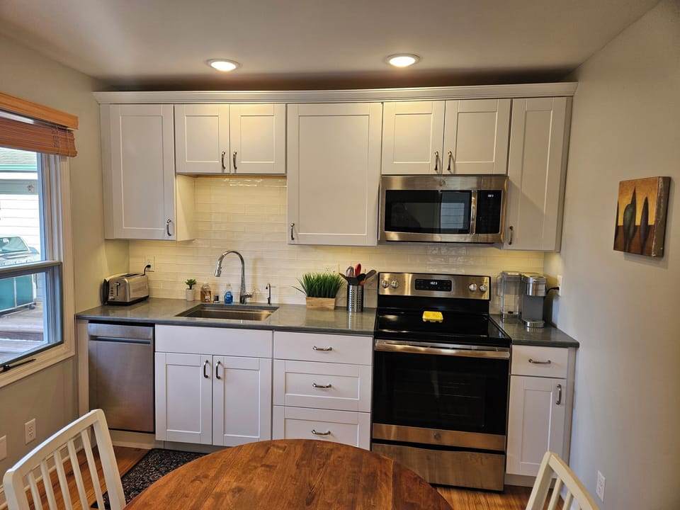 Kitchen has full-size frig & stove, built-in dishwasher & a Keurig coffee maker.