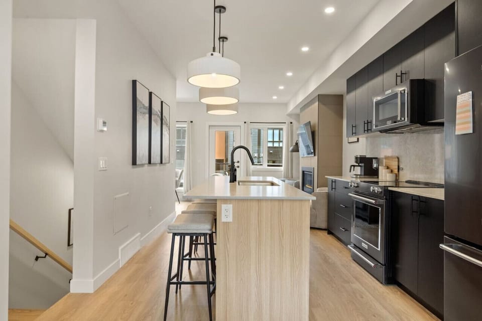 Full kitchen including a drip coffee maker, ground coffee, sugar, tea, ketchup, relish & mustard.
