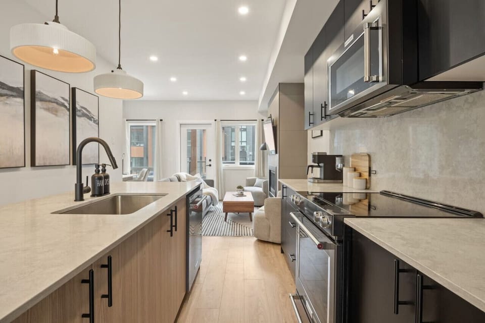 Full kitchen including a drip coffee maker, ground coffee, sugar, tea, ketchup, relish & mustard.
