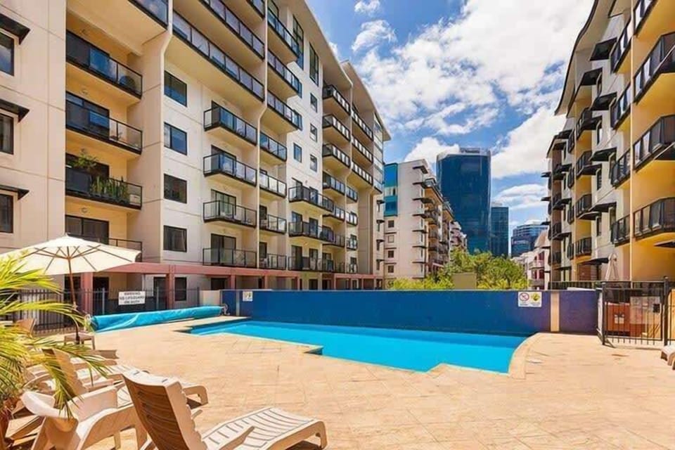 Enjoy resort-style living right in the city! Featuring a fantastic pool and lush surroundings.
