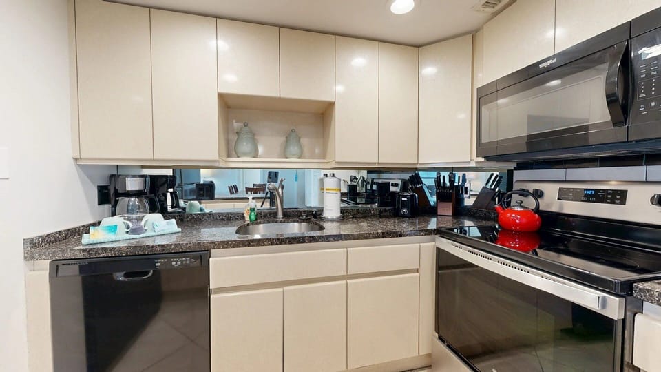 Kitchen is fully stocked for all your cooking needs.