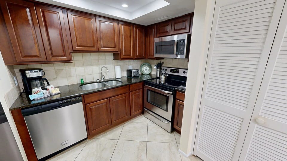 Kitchen is fully stocked for all your cooking needs.