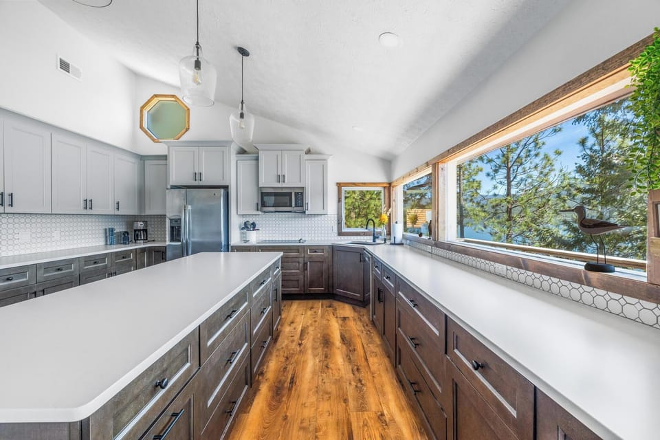 Spacious, fully stocked with island, bar seating, and ample storage (East Wing).