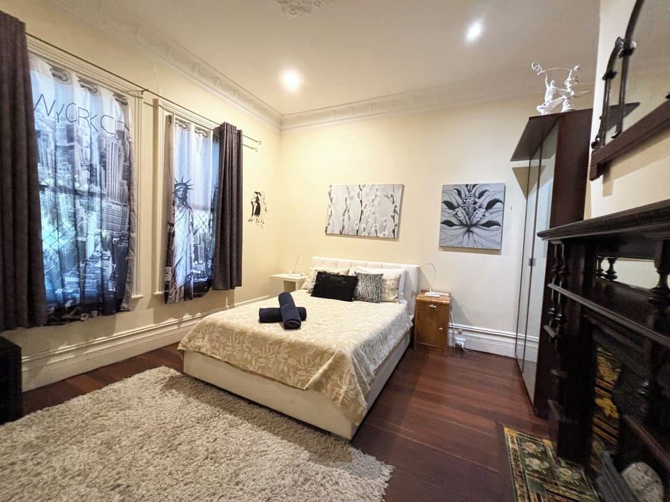 Spacious bedroom with queen bed. Note there is a separate Aircon in this room for your comfort.  Large wardrobe for your stay.