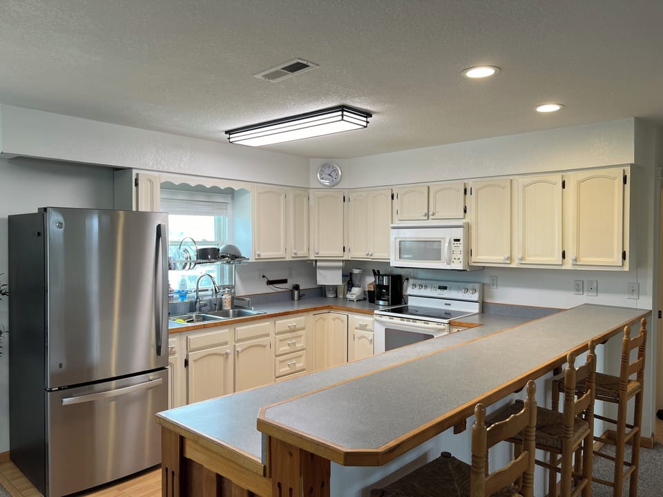 Full kitchen including; fridge, freezer, coffee maker, utensils, etc.