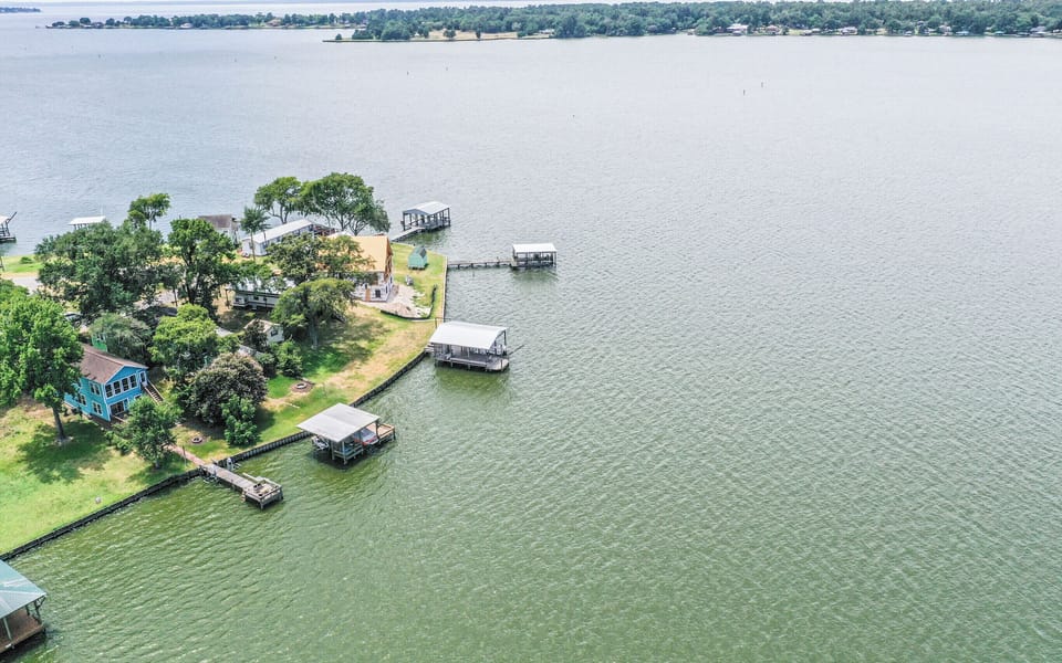 Aerial view of the house and lake.