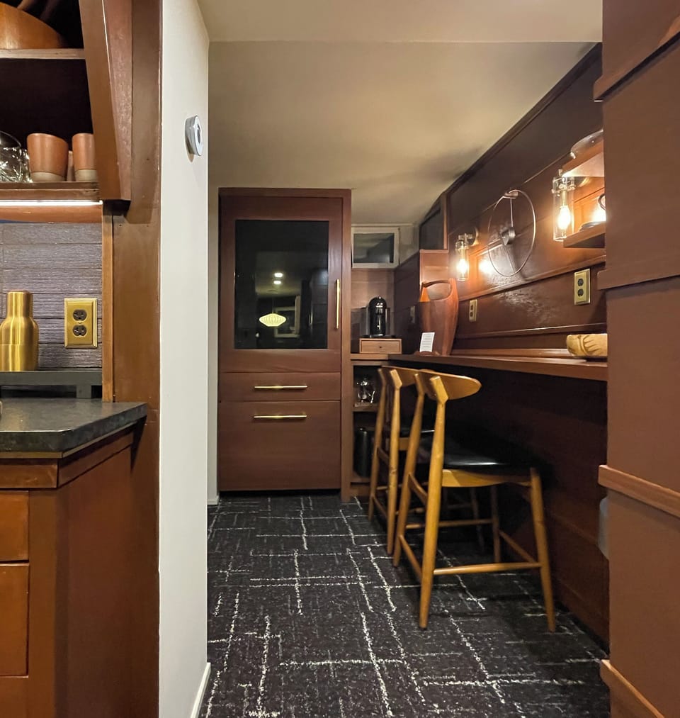 Refrigerator with ice cube maker and separate freezer drawer/wine cooler.