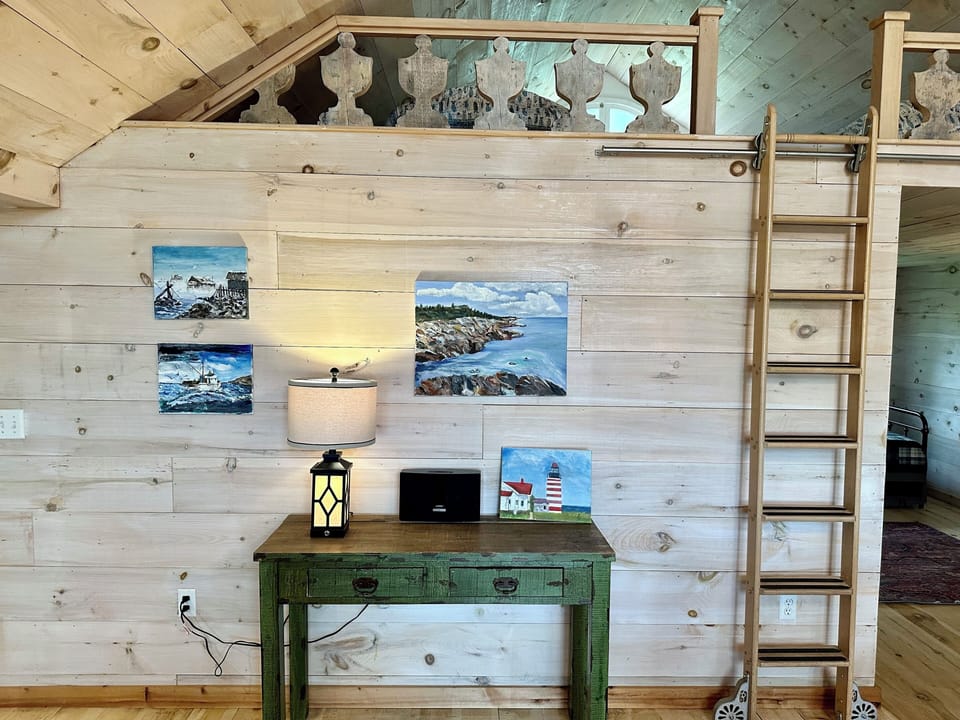 The ladder provides access to the loft.  (lift and pull out the base for use).