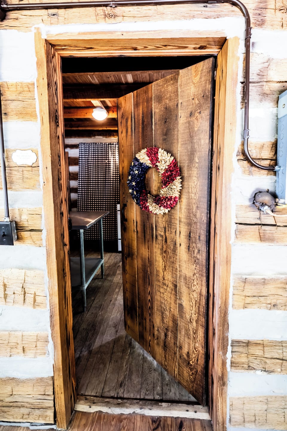 Door from screened in porch leading to inside of kitchen. 