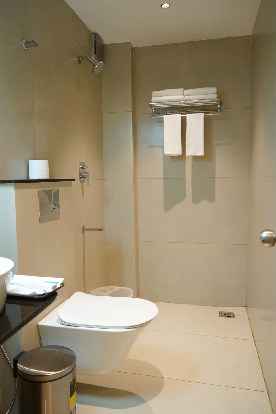 Shower, rainfall showerhead, towels, soap