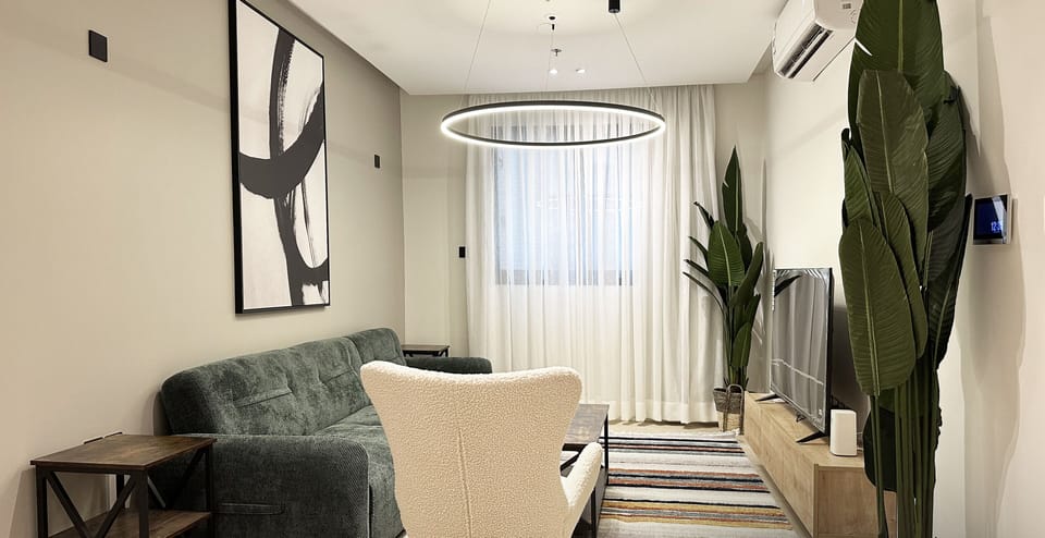 Design Apartment, 3 Bedrooms | Living area | Flat-screen TV