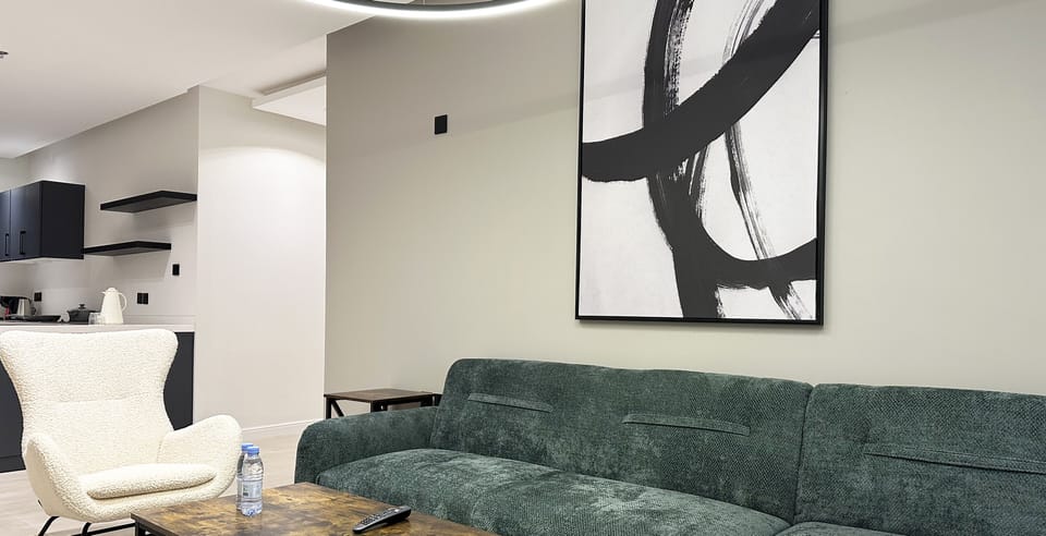 Design Apartment, 3 Bedrooms | Living area | Flat-screen TV