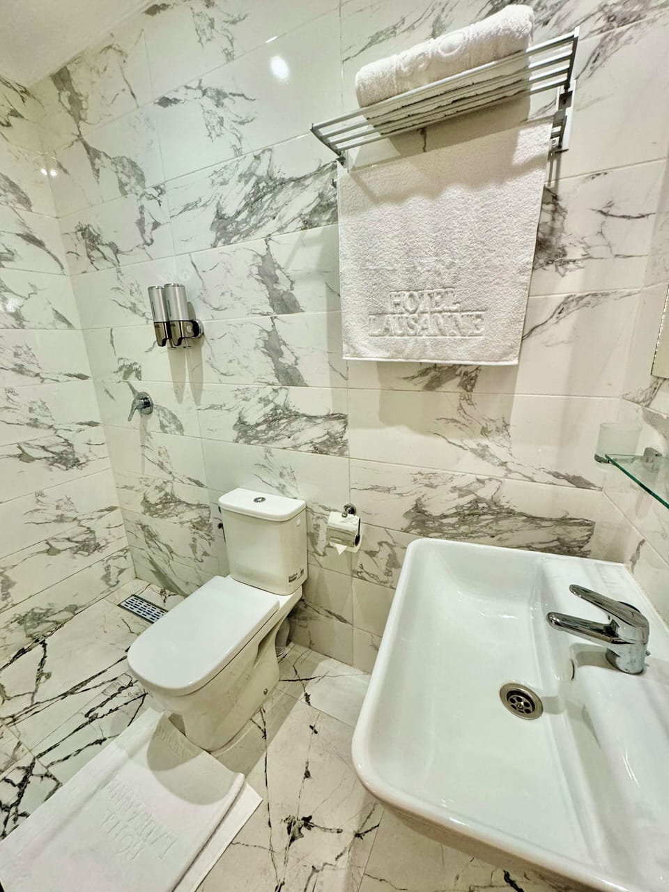 Shower, rainfall showerhead, towels, soap