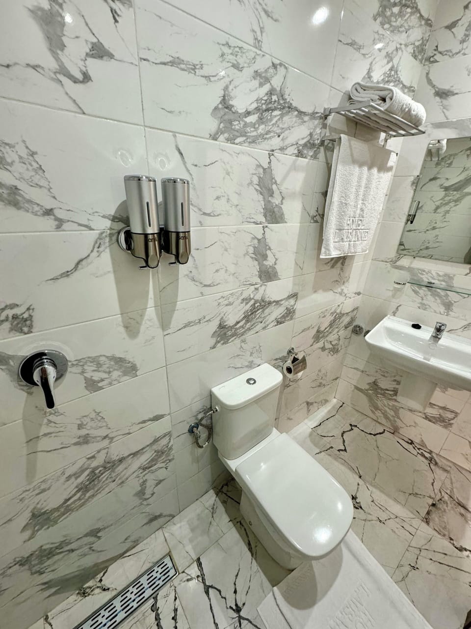 Shower, rainfall showerhead, towels, soap