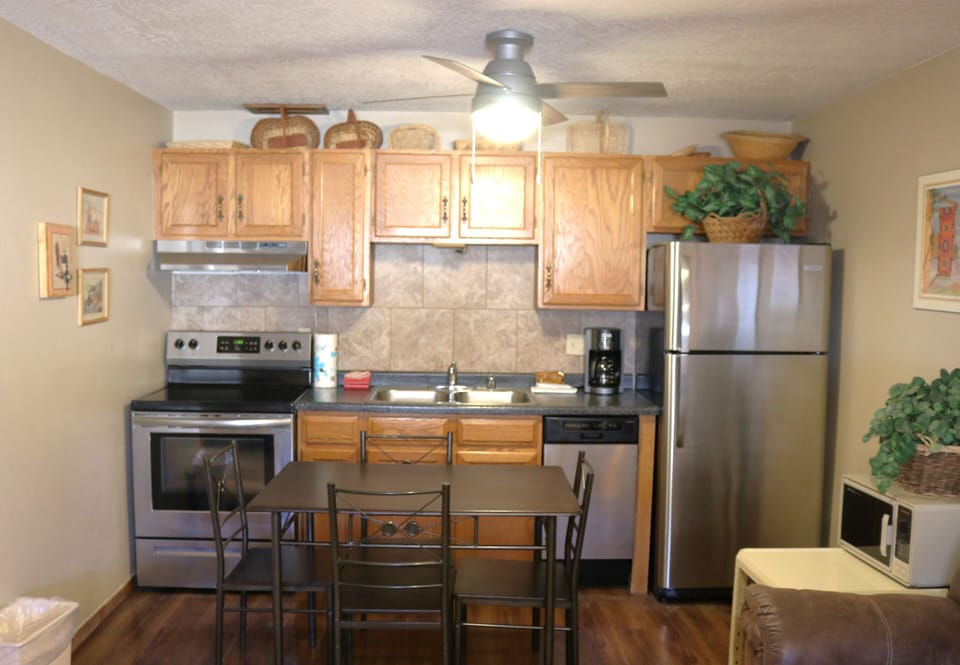 Your fully equipped kitchen features stainless steel appliances, a cozy dining area, and everything you need to prepare delicious home-cooked meals during your stay.