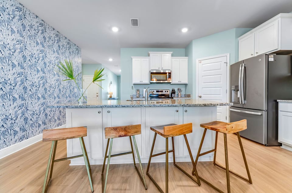 Open floor plan throughout the kitchen, dining, and living areas