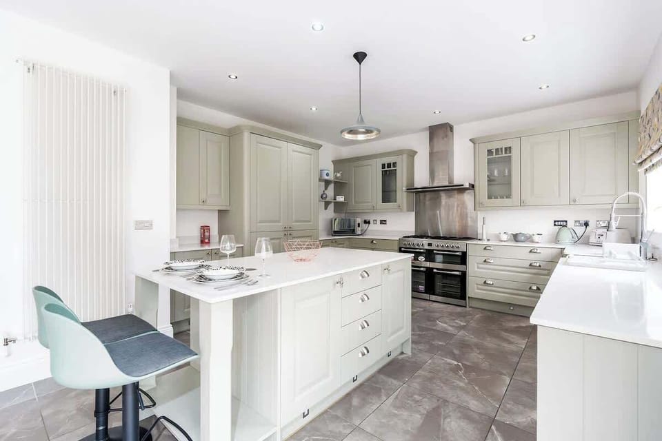 Enjoy cooking in our elegant and fully equipped kitchen. It is indeed perfect for long-term stays, washer and dryer are also in the house.