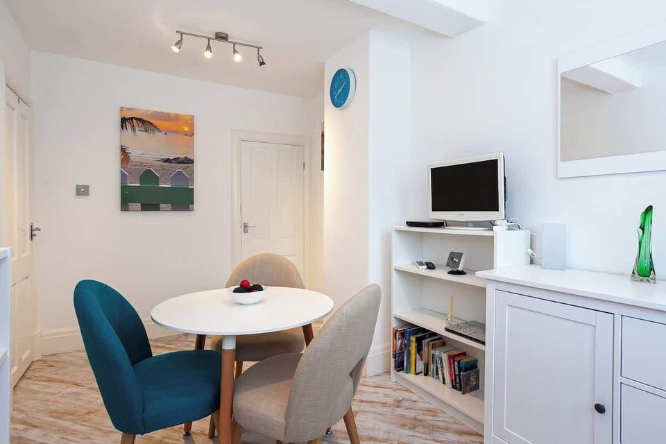 Dining space with a little library to enjoy from.