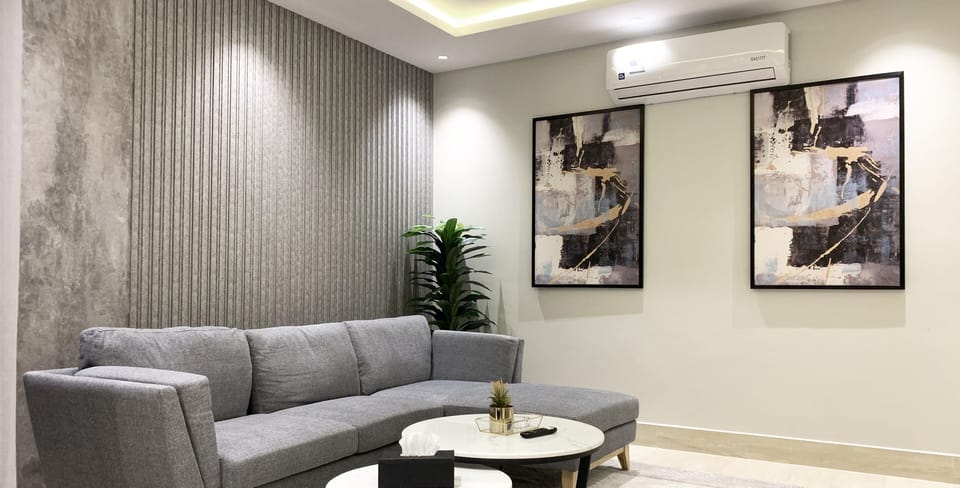 Design Apartment, 3 Bedrooms | Living area | Flat-screen TV